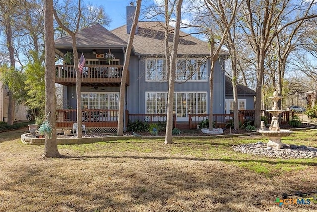 2113 Highland Dr, Salado, TX 76571 - rear view of house with a balcony, ceiling fan, a lawn, and roof with shingles