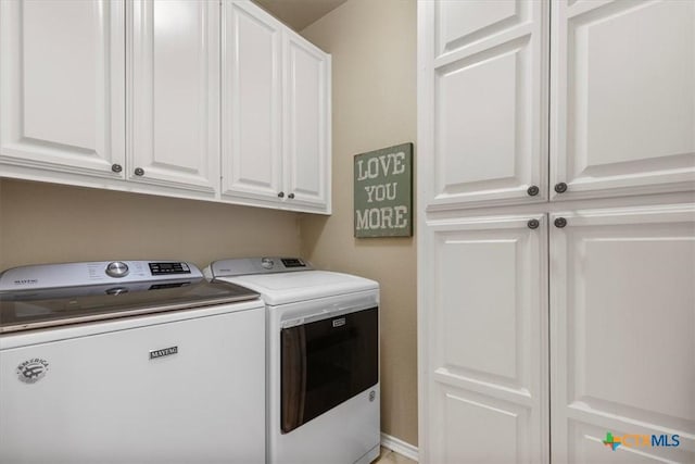 2113 Highland Dr, Salado, TX 76571 - laundry area featuring washer and clothes dryer and cabinet space