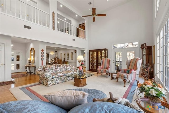 2113 Highland Dr, Salado, TX 76571 - living room featuring a ceiling fan, a towering ceiling, wood finished floors, and recessed lighting