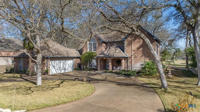 2113 Highland Dr, Salado, TX 76571 - traditional-style home with brick siding, driveway, a garage, and a porch