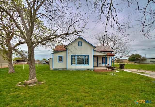 view of front of home with a front lawn and covered porch