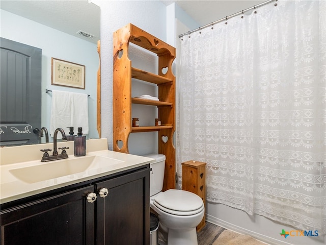 900 Hatton Hill Ln, Austin, TX 78725 - bathroom with vanity, wood finished floors, and shower / bath combination with curtain