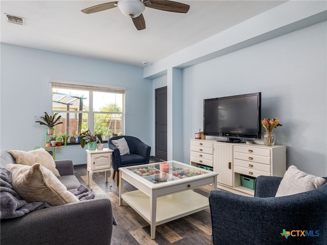 900 Hatton Hill Ln, Austin, TX 78725 - living area with dark wood finished floors and a ceiling fan