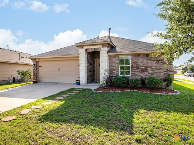 900 Hatton Hill Ln, Austin, TX 78725 - single story home with brick siding, an attached garage, concrete driveway, a front lawn, and roof with shingles