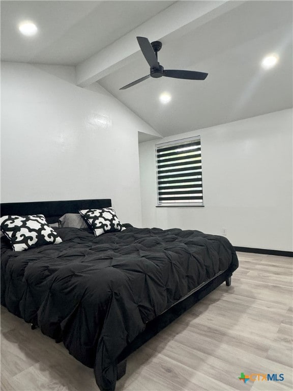 bedroom with vaulted ceiling with beams, light wood finished floors, and ceiling fan