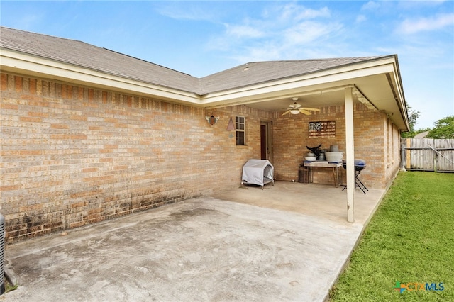 view of patio / terrace featuring ceiling fan and fence