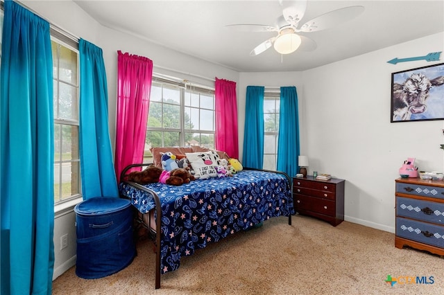 bedroom featuring baseboards and ceiling fan