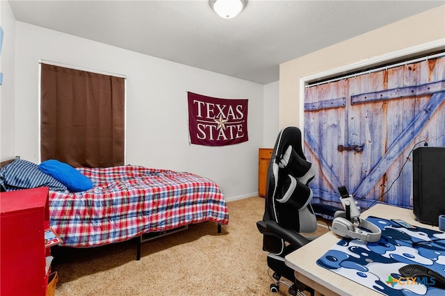 bedroom featuring carpet floors and baseboards
