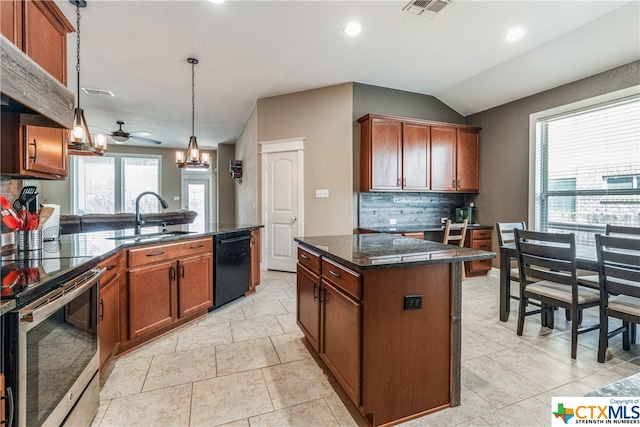 kitchen with a center island, black dishwasher, sink, ceiling fan, and backsplash