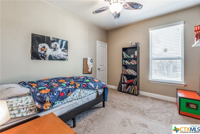 carpeted bedroom with ceiling fan