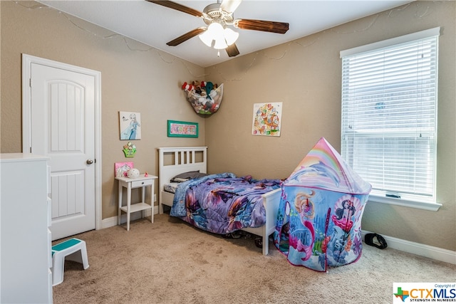 carpeted bedroom with ceiling fan