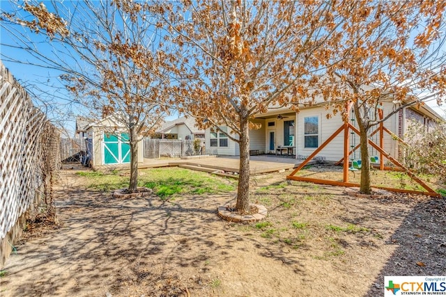 1620 Sun Ledge Way, New Braunfels, TX 78130 - rear view of property with a shed and a patio