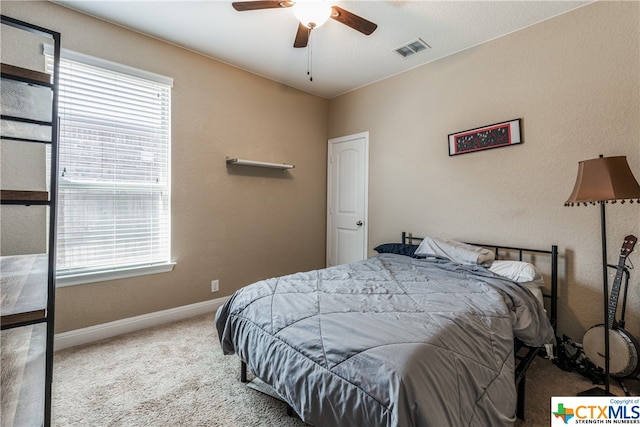 bedroom with ceiling fan and carpet