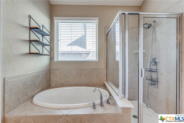 bathroom with shower with separate bathtub