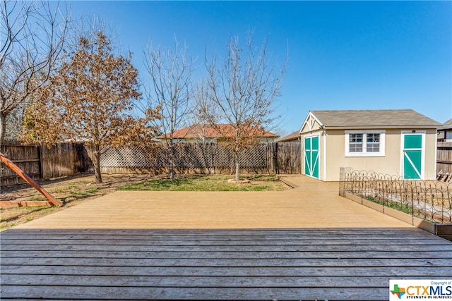 wooden terrace with a shed