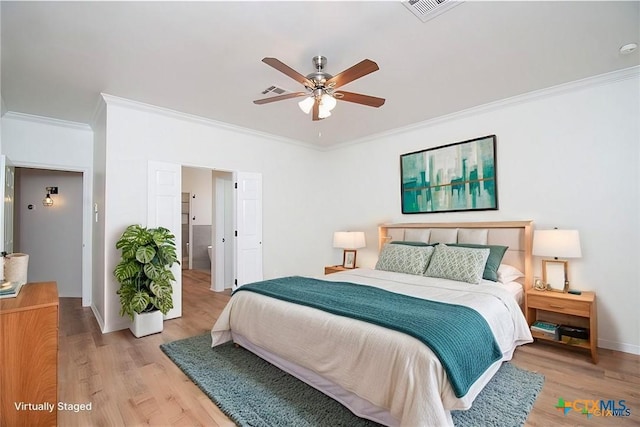 bedroom with ceiling fan, crown molding, and light hardwood / wood-style flooring