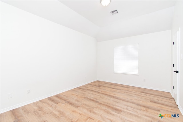 spare room with light wood-type flooring