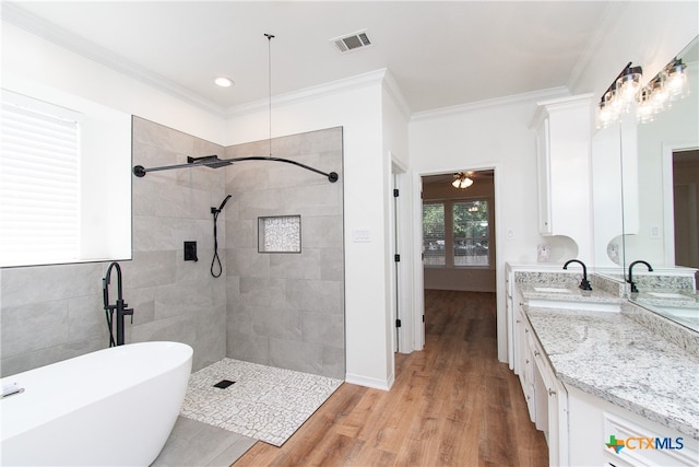 bathroom with hardwood / wood-style floors, ceiling fan, ornamental molding, independent shower and bath, and vanity