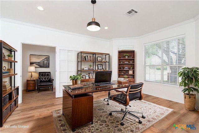 office area featuring crown molding and light hardwood / wood-style flooring