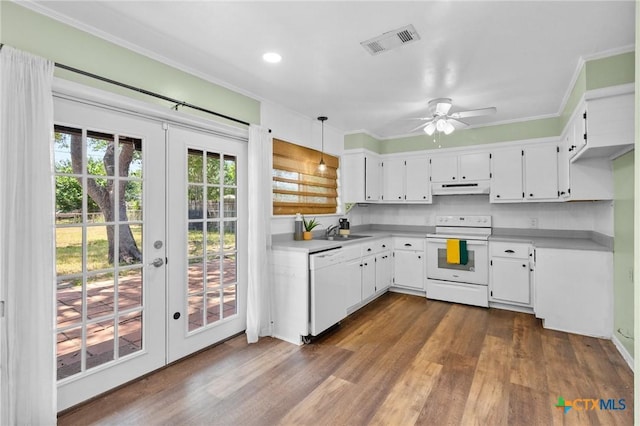 313 Pheasant Dr, Victoria, TX 77905 - kitchen with white appliances, under cabinet range hood, a sink, french doors, and dark wood finished floors