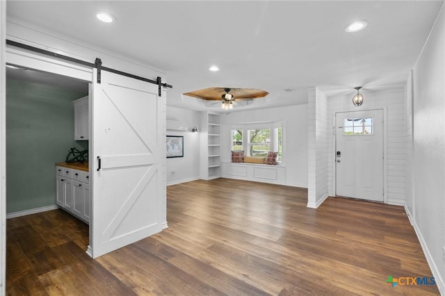 313 Pheasant Dr, Victoria, TX 77905 - entrance foyer with a barn door, a ceiling fan, dark wood-type flooring, baseboards, and recessed lighting