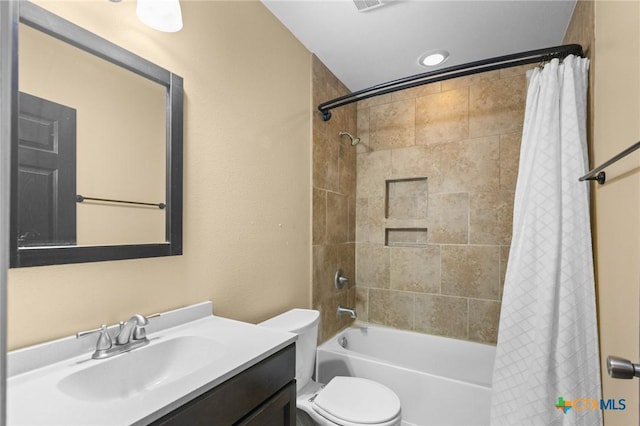 313 Pheasant Dr, Victoria, TX 77905 - bathroom featuring vanity, shower / bathtub combination with curtain, and toilet
