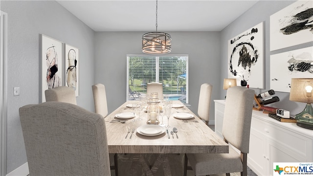 dining space featuring an inviting chandelier