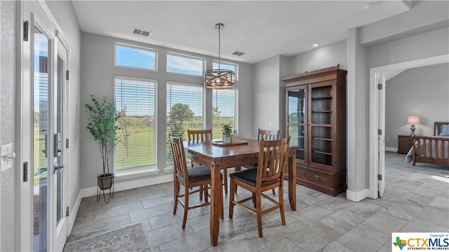 dining room with a notable chandelier