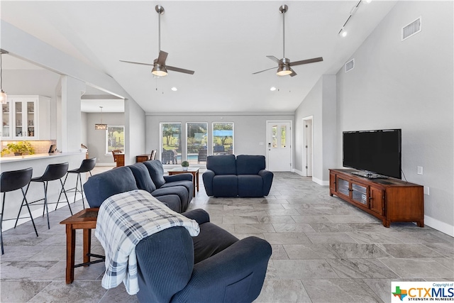 living room featuring ceiling fan, track lighting, and high vaulted ceiling