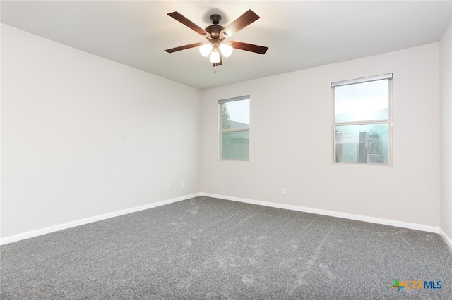 spare room with ceiling fan and carpet floors