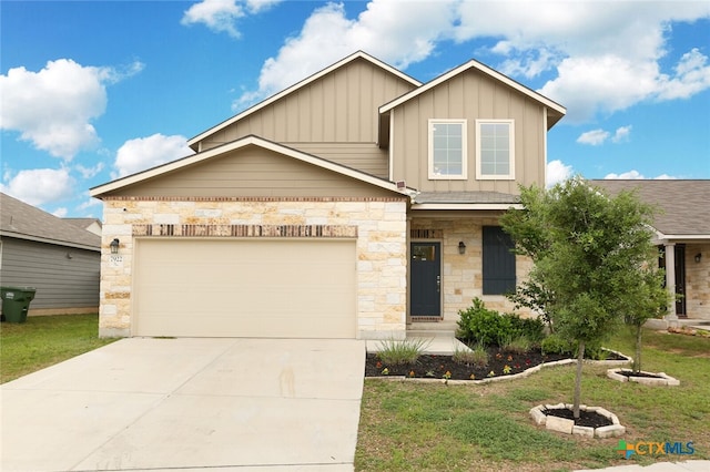 view of front of property with a front lawn and a garage