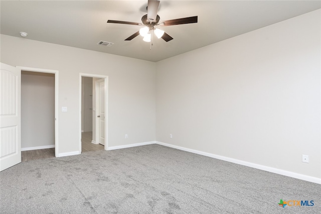 unfurnished bedroom featuring ceiling fan and light colored carpet