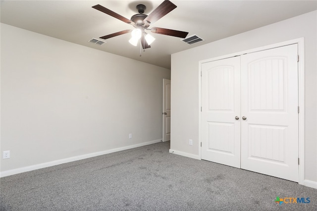 unfurnished bedroom with ceiling fan, a closet, and carpet floors