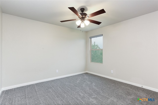 empty room with carpet flooring and ceiling fan