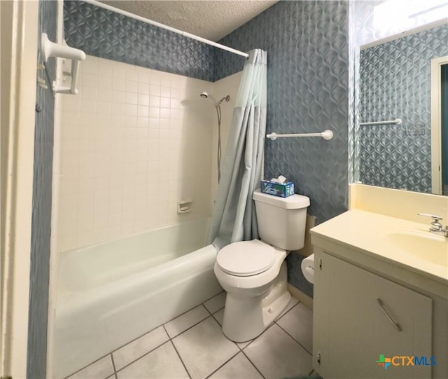 full bathroom with vanity, tile patterned floors, shower / bath combination with curtain, toilet, and a textured ceiling