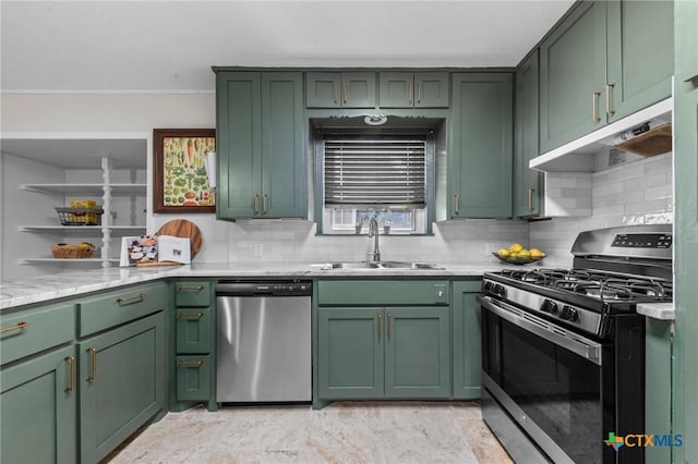 2105 S 49th St, Temple, TX 76504 - kitchen with stainless steel appliances, green cabinetry, under cabinet range hood, a sink, and ornamental molding