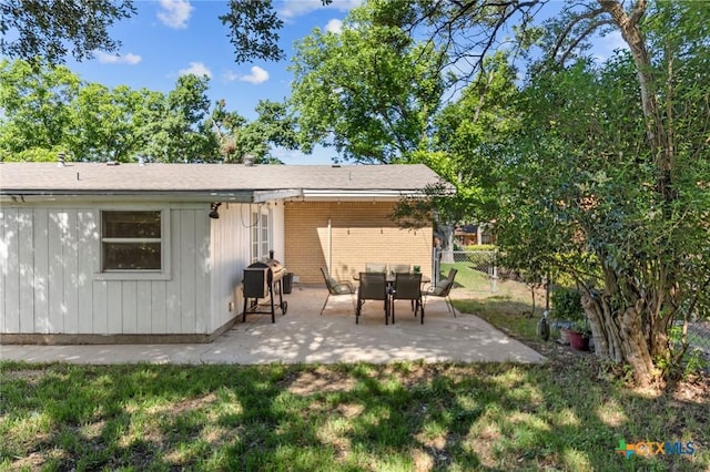 2105 S 49th St, Temple, TX 76504 - back of house featuring a patio area and brick siding