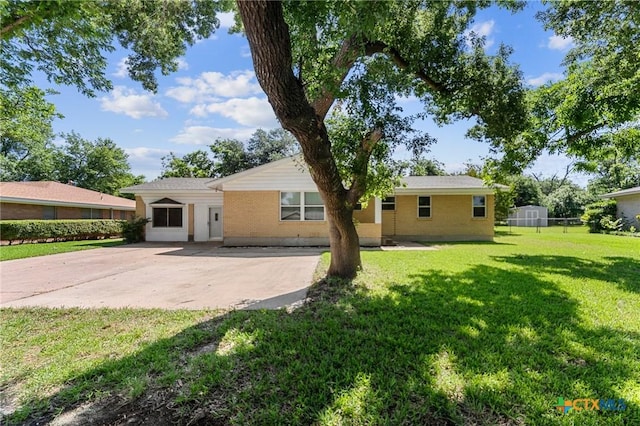 2105 S 49th St, Temple, TX 76504 - rear view of house with a lawn and a patio