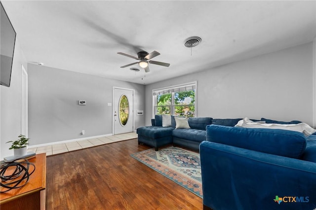2105 S 49th St, Temple, TX 76504 - living room featuring a ceiling fan and wood finished floors