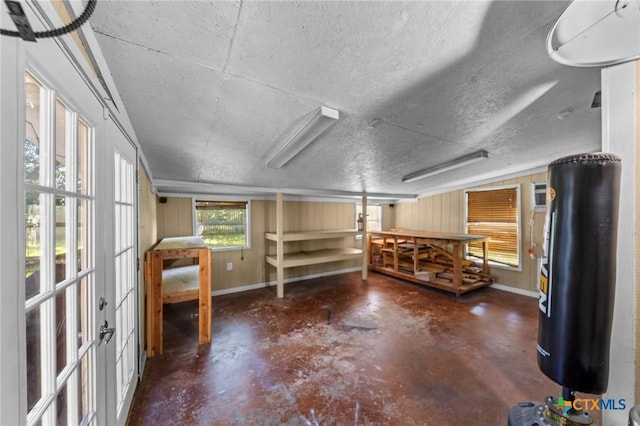 2105 S 49th St, Temple, TX 76504 - miscellaneous room with finished concrete flooring, a textured ceiling, and baseboards