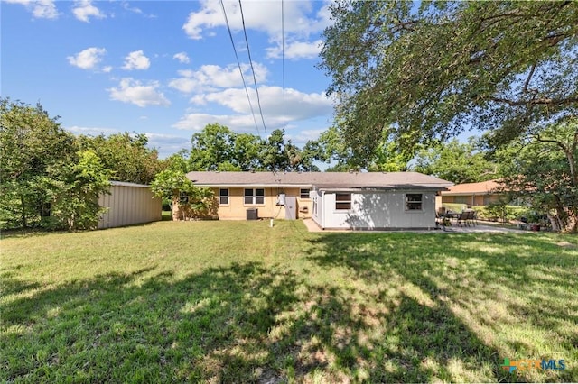 2105 S 49th St, Temple, TX 76504 - back of house featuring a yard and a patio area