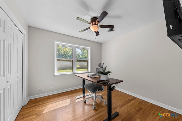 2105 S 49th St, Temple, TX 76504 - home office featuring light wood finished floors, baseboards, and ceiling fan