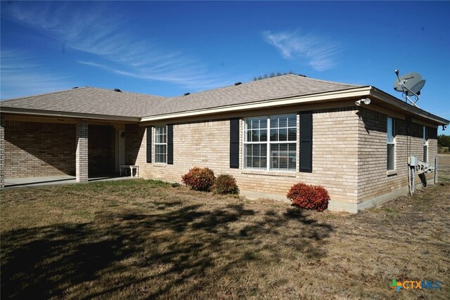 view of property exterior with a lawn