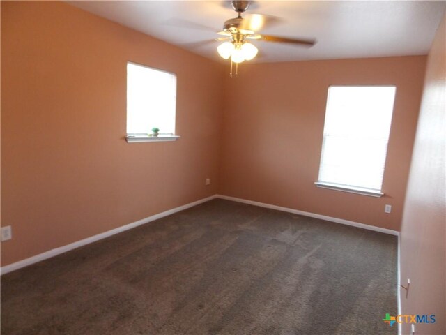 513 Pumpkin Dr, Temple, TX 76502 - empty room with healthy amount of natural light, dark colored carpet, and ceiling fan