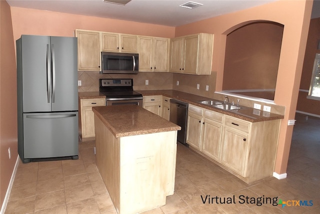 513 Pumpkin Dr, Temple, TX 76502 - kitchen with appliances with stainless steel finishes, light brown cabinets, a center island, tasteful backsplash, and light tile patterned flooring