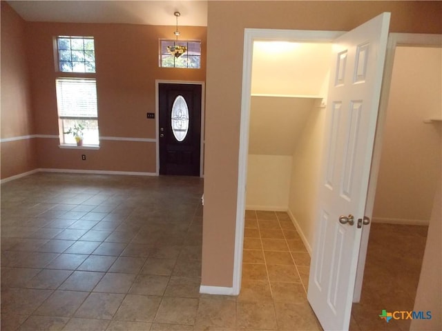 513 Pumpkin Dr, Temple, TX 76502 - foyer featuring light tile patterned floors and baseboards