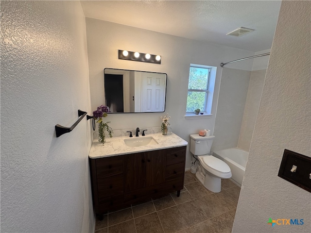513 Pumpkin Dr, Temple, TX 76502 - bathroom with tile patterned floors, vanity, a textured wall, and shower / washtub combination