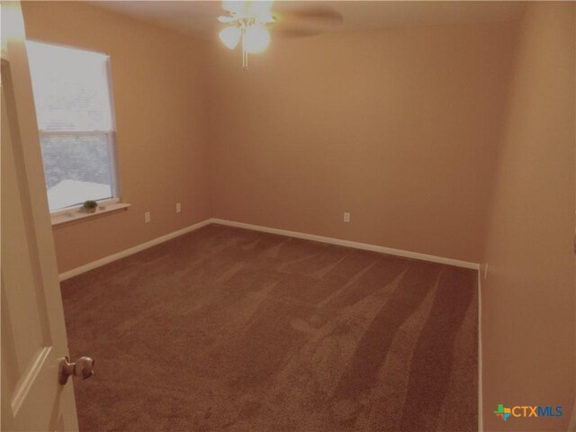513 Pumpkin Dr, Temple, TX 76502 - unfurnished room with dark carpet and ceiling fan