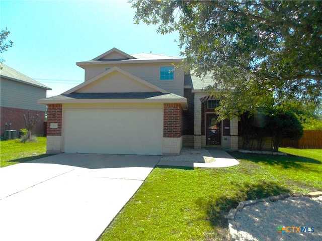 513 Pumpkin Dr, Temple, TX 76502 - traditional-style house featuring brick siding, a front lawn, an attached garage, and concrete driveway