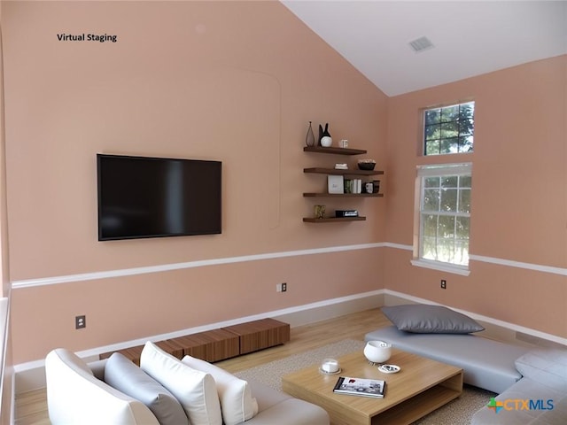 513 Pumpkin Dr, Temple, TX 76502 - living area featuring vaulted ceiling, healthy amount of natural light, and wood finished floors